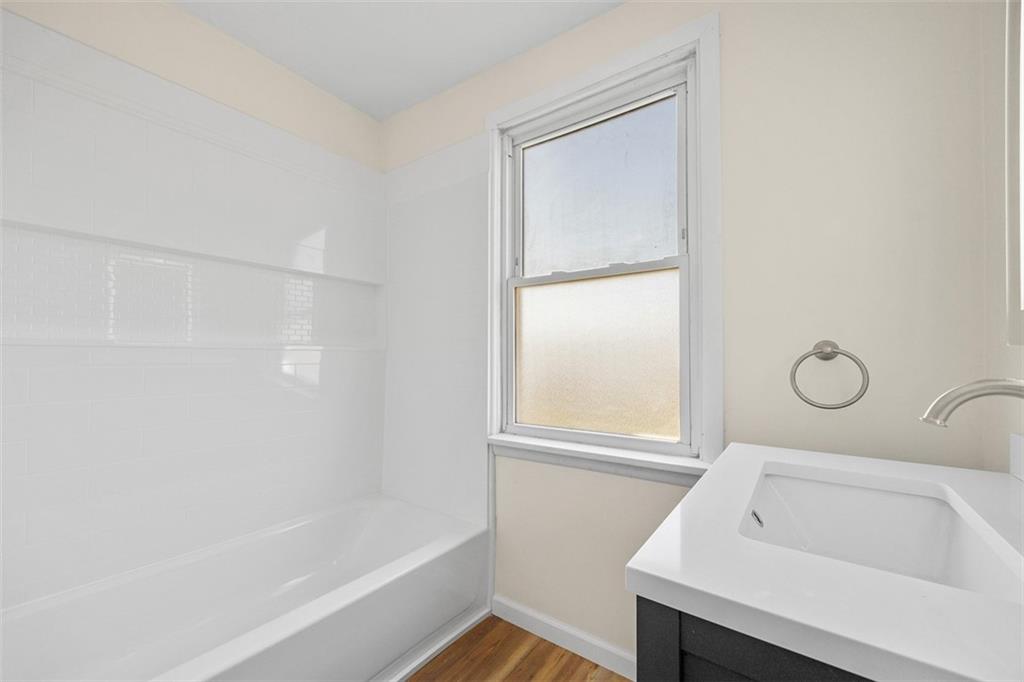 1700 Beaver Road Ambridge, PA 15003 - Photo 22 of 43 a bathroom with a bathtub and a window