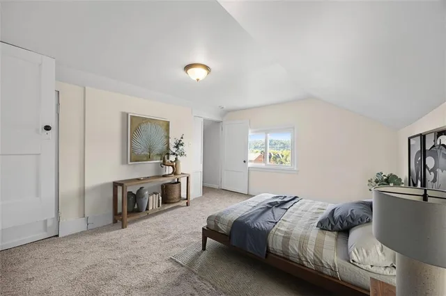 a bedroom with a bed and a table in it