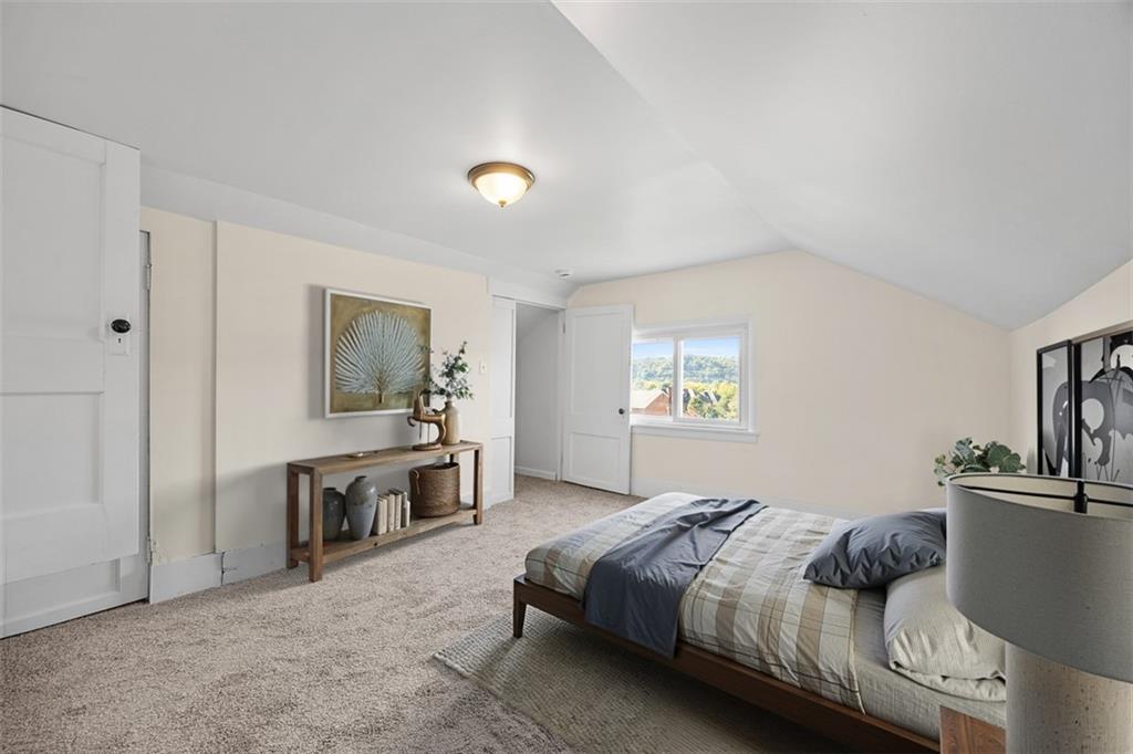 1700 Beaver Road Ambridge, PA 15003 - Photo 24 of 43 a bedroom with a bed and a table in it