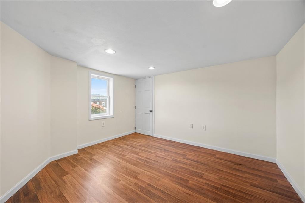 1700 Beaver Road Ambridge, PA 15003 - Photo 29 of 43 an empty room with wooden floor and windows