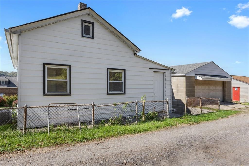 1700 Beaver Road Ambridge, PA 15003 - Photo 3 of 43 a front view of a house with garden