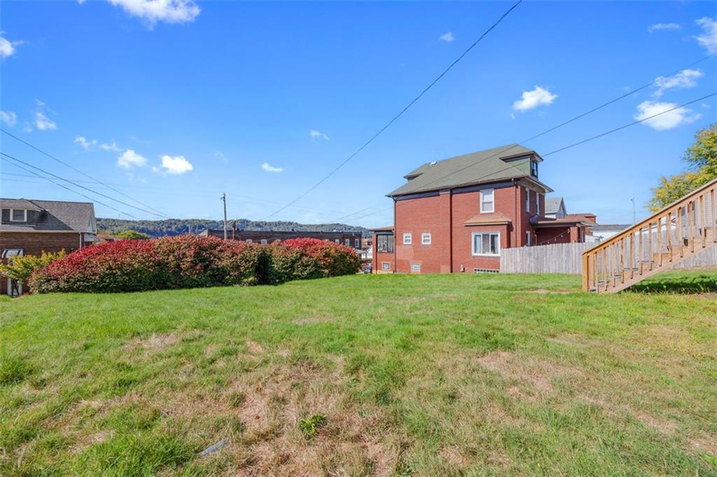1700 Beaver Road Ambridge, PA 15003 - Photo 35 of 43 a view of a backyard with plants and large trees