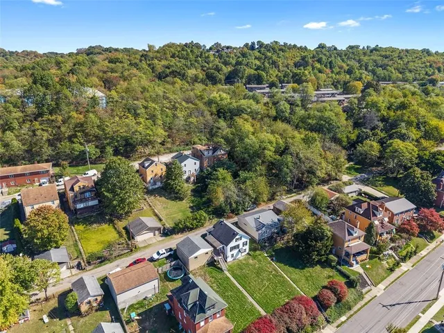 an aerial view of a house with a garden