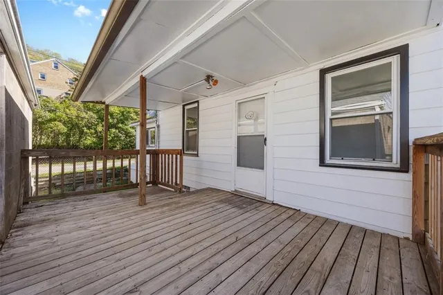 a view of front door deck and furniture