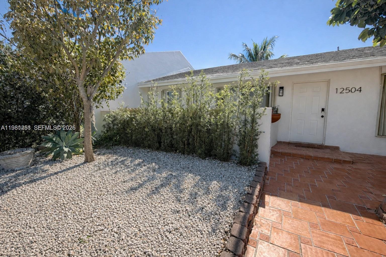 12504 Southwest 112th Terrace Miami, FL 33186 - Photo 1 of 12 a view of a backyard