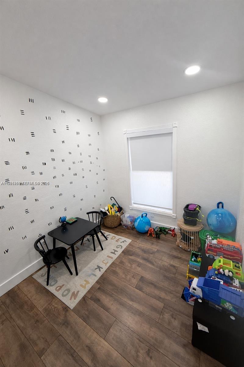 12504 Southwest 112th Terrace Miami, FL 33186 - Photo 7 of 12 a room with furniture and wooden floor