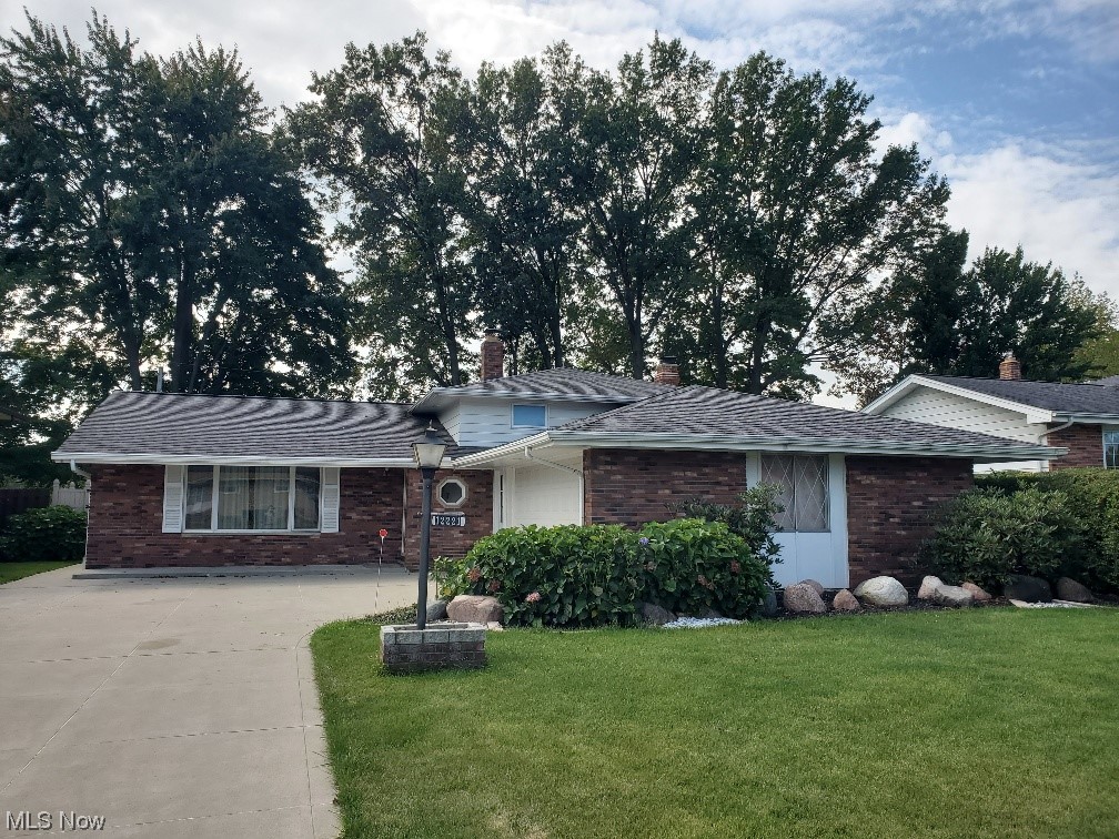 Split house with a front lawn