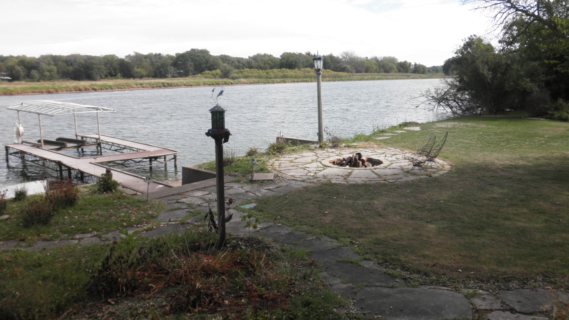 808 Tuxedo Lane Cary, IL 60013 - Photo 14 of 28 a view of a lake with a house in the background