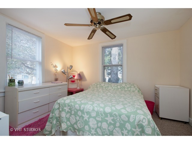 808 Tuxedo Lane Cary, IL 60013 - Photo 18 of 28 a bedroom with a bed and a window