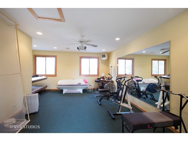 808 Tuxedo Lane Cary, IL 60013 - Photo 23 of 28 a living room with furniture and a large window