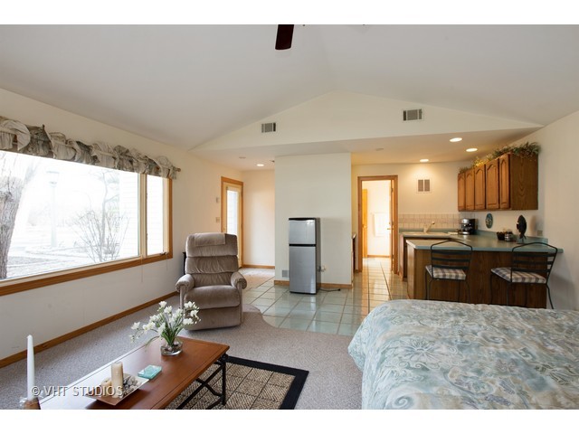 808 Tuxedo Lane Cary, IL 60013 - Photo 26 of 28 a large bedroom with a large bed and large windows