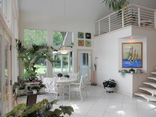 808 Tuxedo Lane Cary, IL 60013 - Photo 8 of 28 a building outdoor space with patio furniture and potted plants