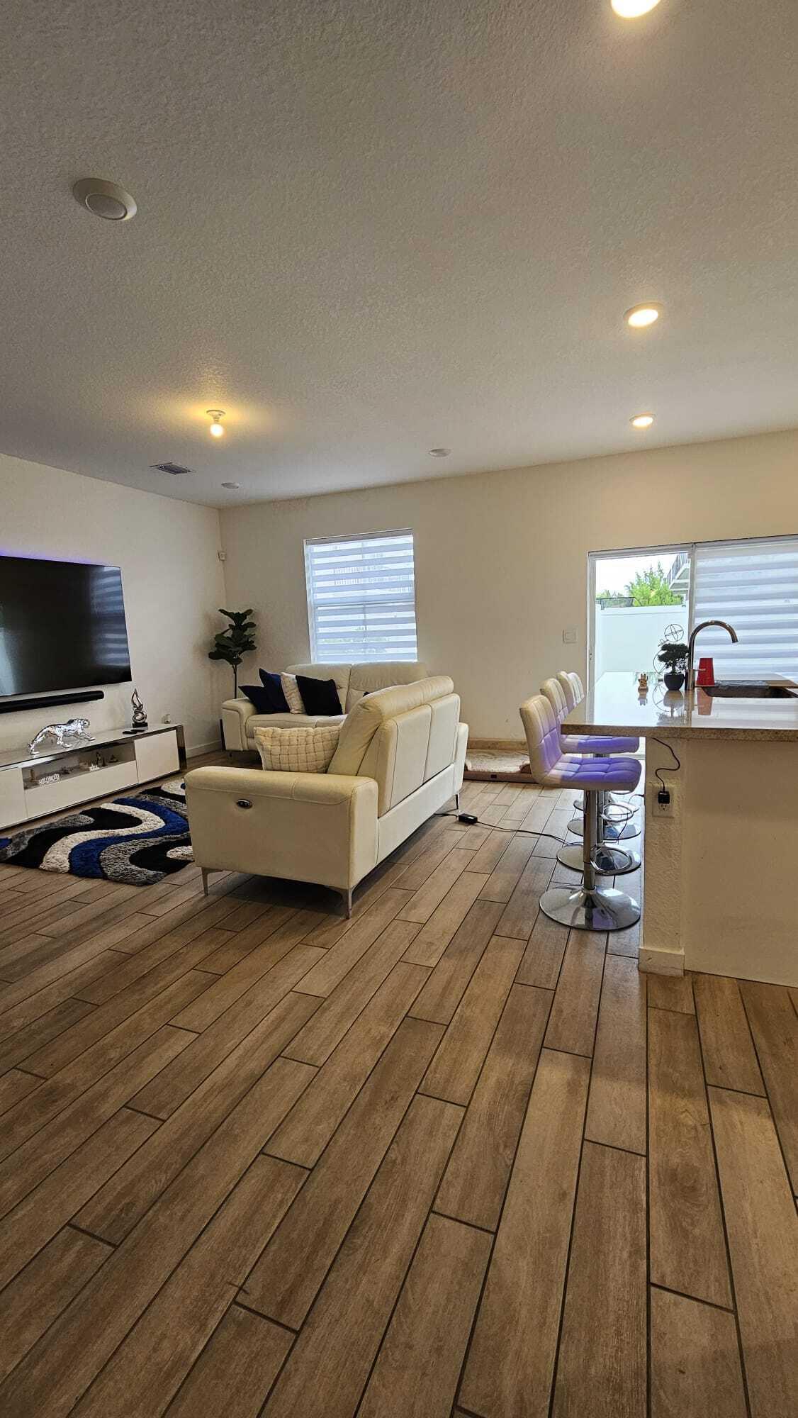 1677 Southeast 8th Street Homestead, FL 33034 - Photo 11 of 52 a living room with furniture and a flat screen tv