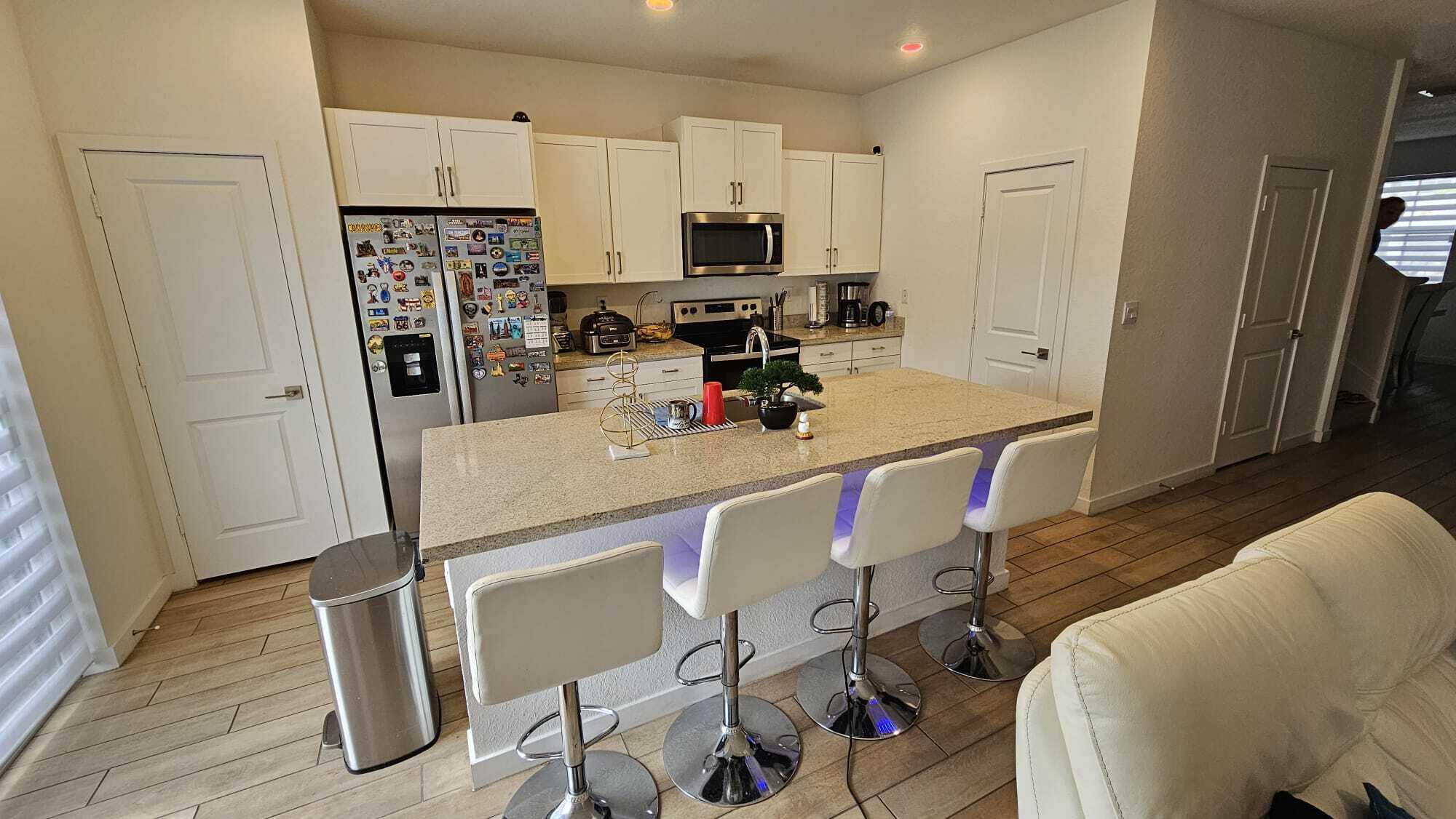 1677 Southeast 8th Street Homestead, FL 33034 - Photo 15 of 52 a kitchen with stainless steel appliances a refrigerator and a stove top oven