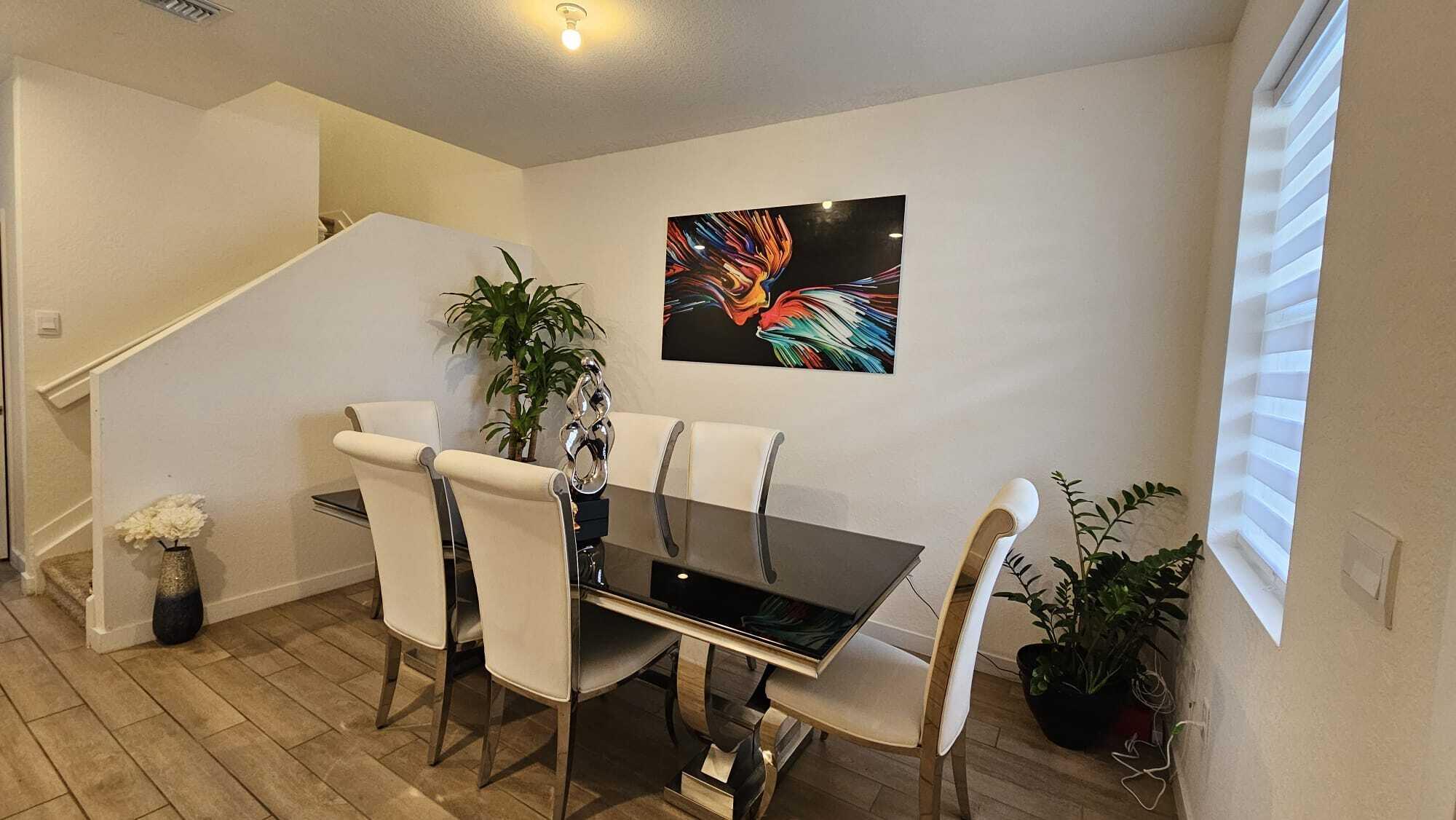 1677 Southeast 8th Street Homestead, FL 33034 - Photo 16 of 52 a view of a dining room with furniture and wooden floor