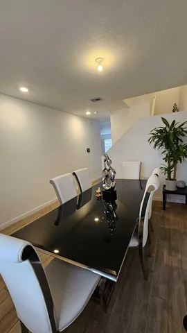a view of a livingroom with furniture and wooden floor