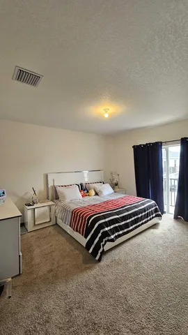 a spacious bathroom with a double vanity sink and a mirror