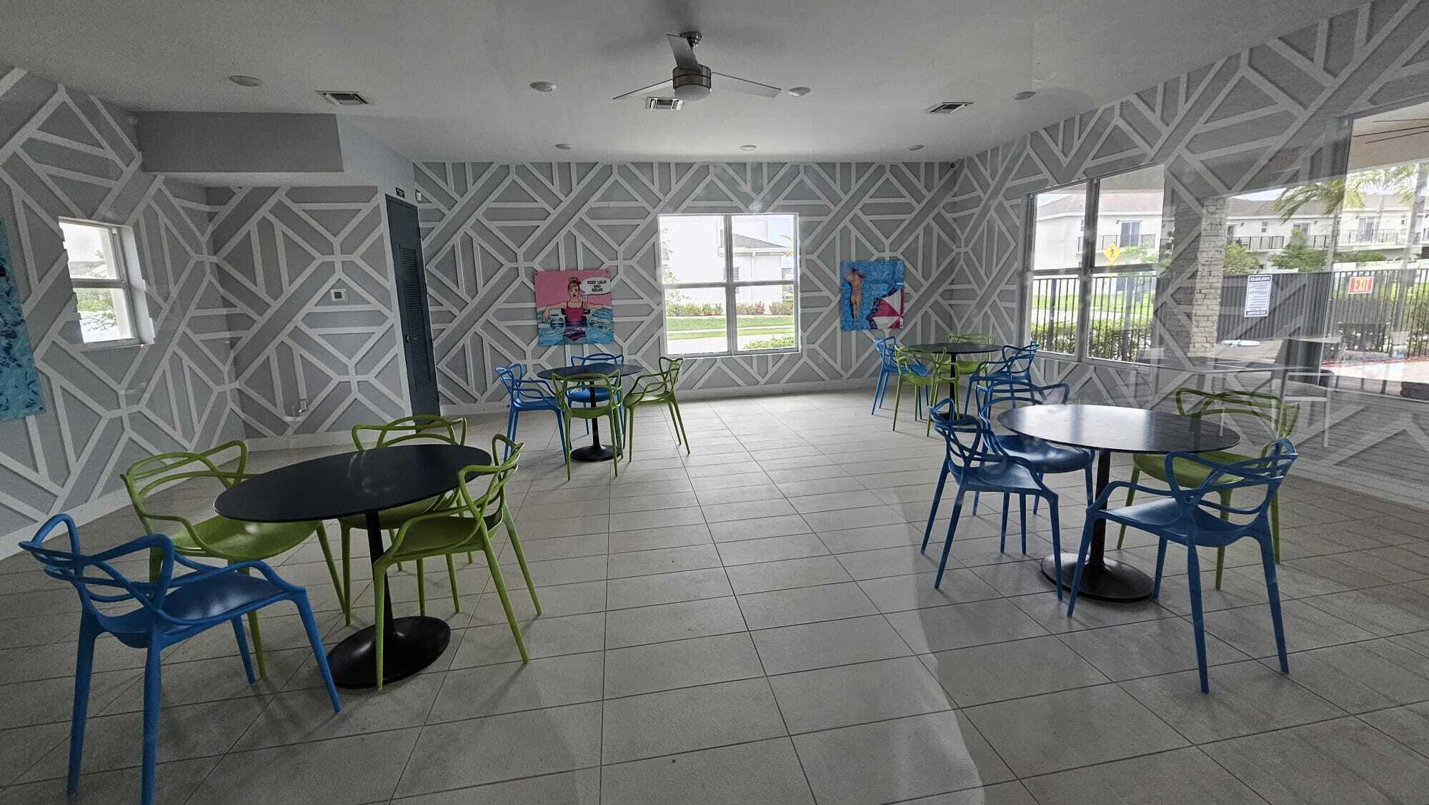 1677 Southeast 8th Street Homestead, FL 33034 - Photo 35 of 52 a view of a dining room with furniture and a chandelier