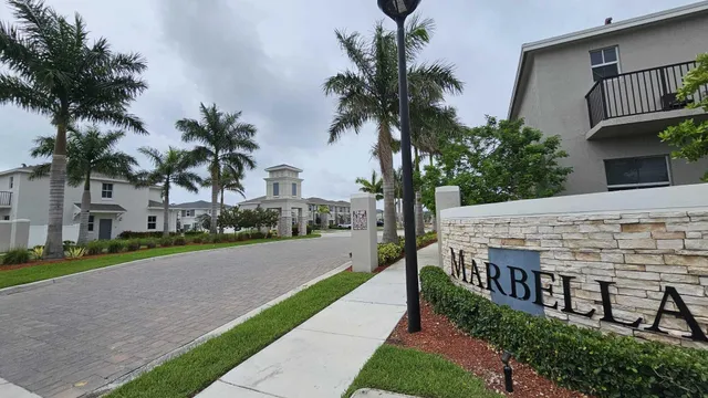 a building with palm trees in front of it