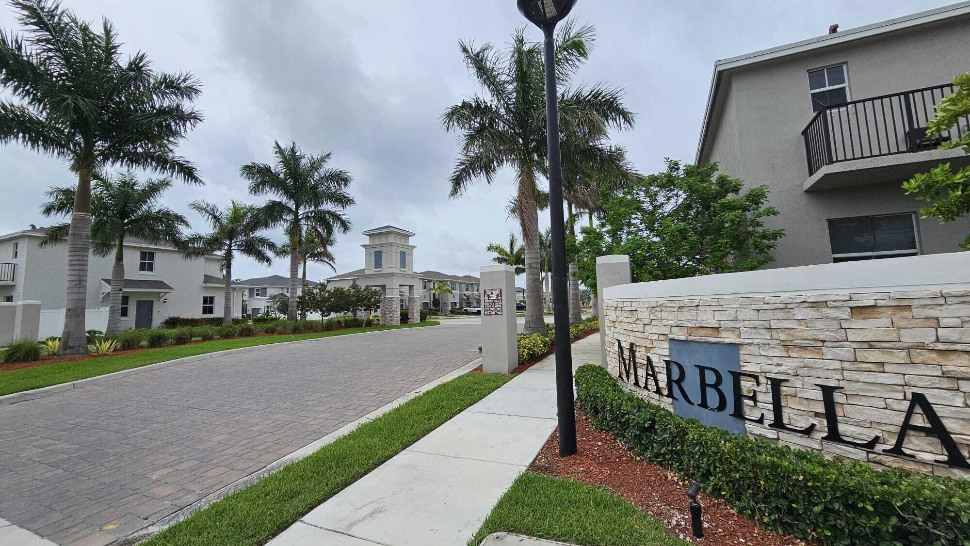 1677 Southeast 8th Street Homestead, FL 33034 - Photo 38 of 52 a view of a house with a yard and potted plants