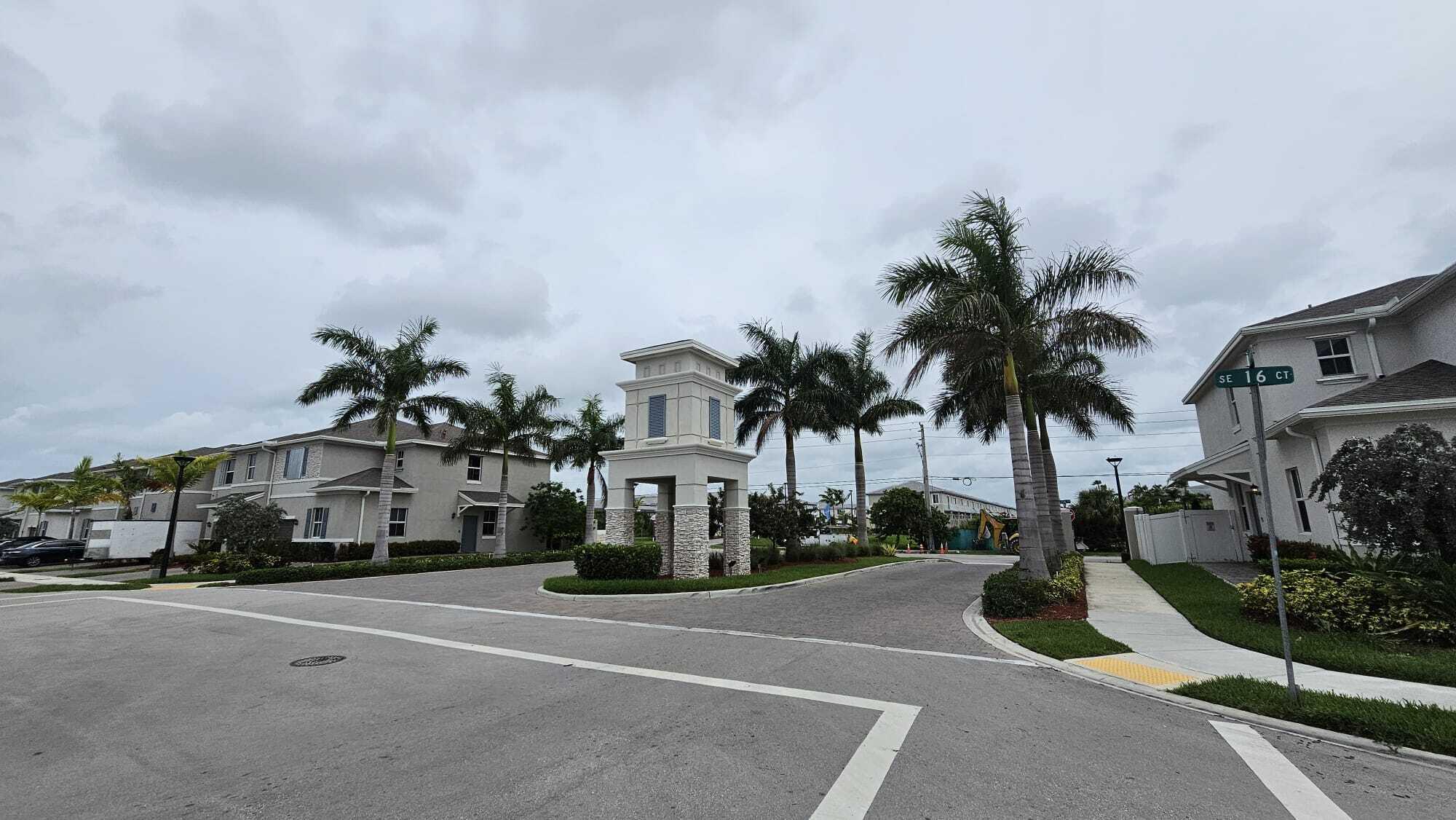 1677 Southeast 8th Street Homestead, FL 33034 - Photo 39 of 52 a group of palm trees in front of house