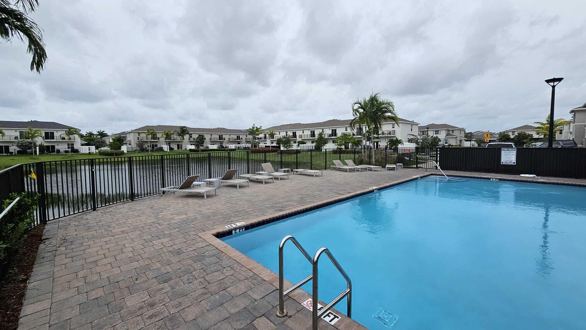 1677 Southeast 8th Street Homestead, FL 33034 - Photo 43 of 52 a view of a lake with a terrace