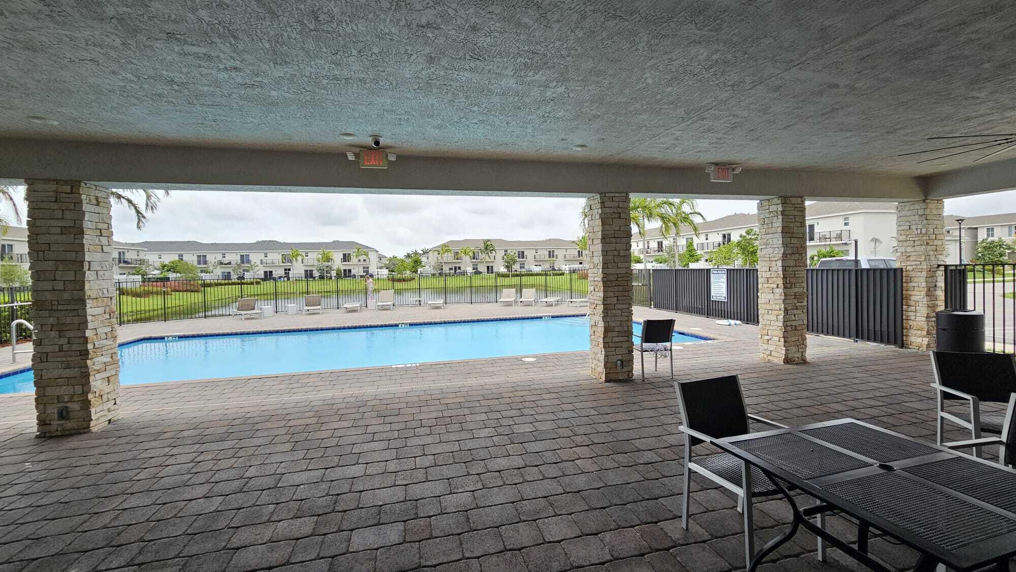 1677 Southeast 8th Street Homestead, FL 33034 - Photo 47 of 52 a living room with a large window