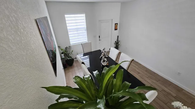 a white toilet sitting next to a shower