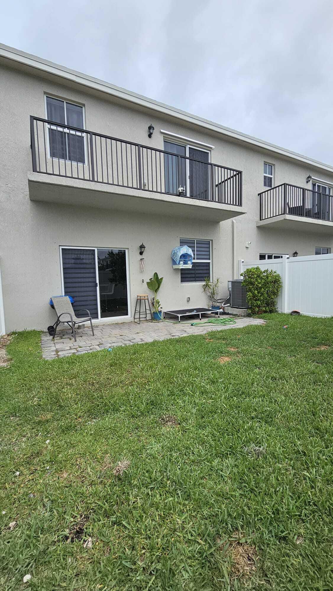 1677 Southeast 8th Street Homestead, FL 33034 - Photo 6 of 52 a front view of a house with garden