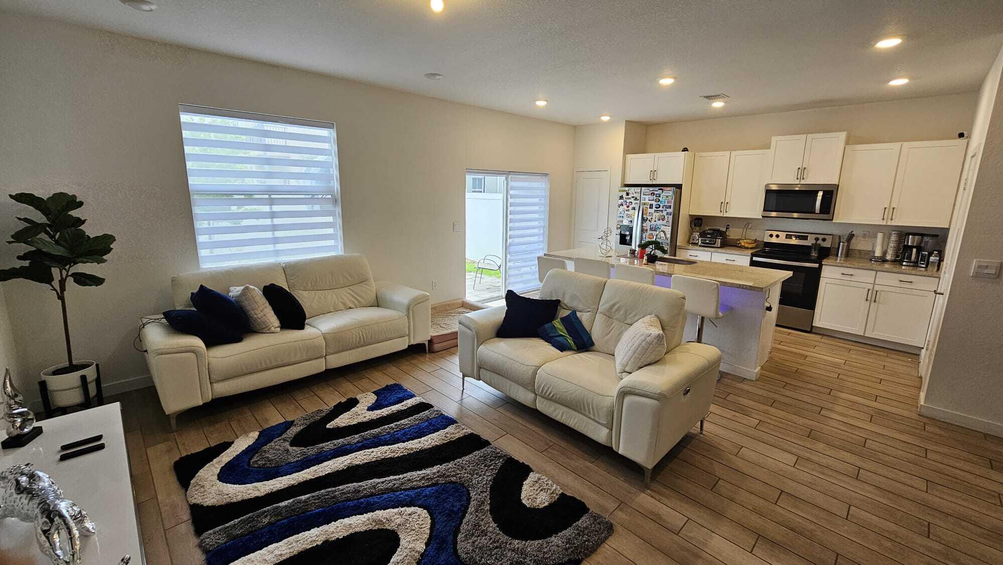 1677 Southeast 8th Street Homestead, FL 33034 - Photo 7 of 52 a living room with furniture and a flat screen tv