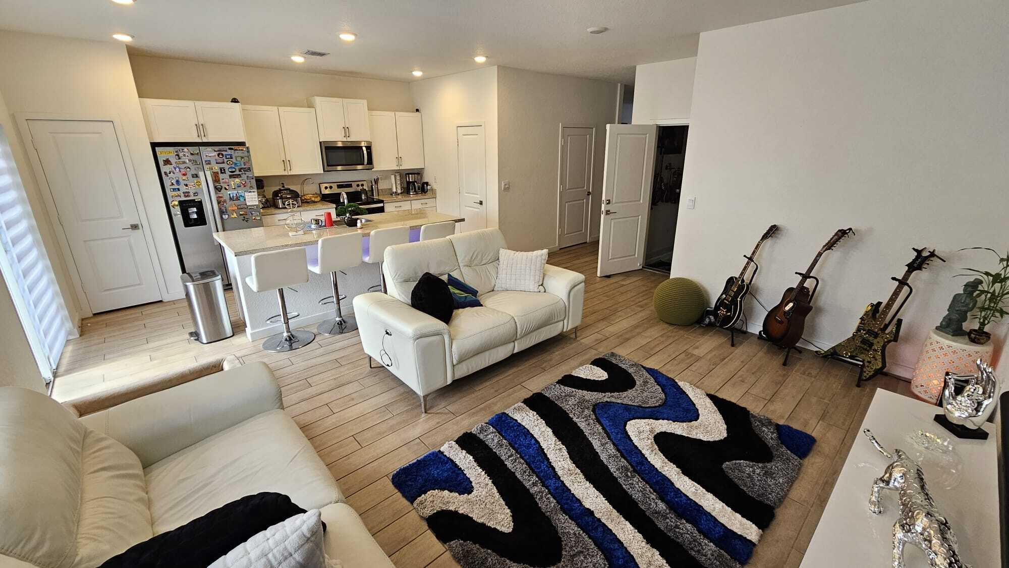 1677 Southeast 8th Street Homestead, FL 33034 - Photo 8 of 52 a living room with furniture and a flat screen tv