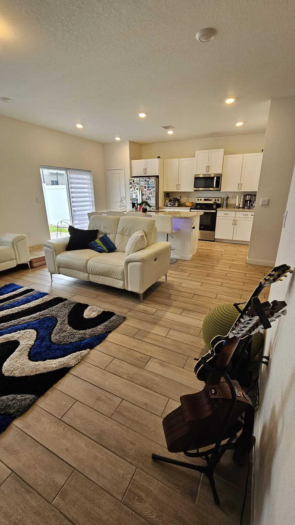1677 Southeast 8th Street Homestead, FL 33034 - Photo 9 of 52 a living room with furniture and kitchen view