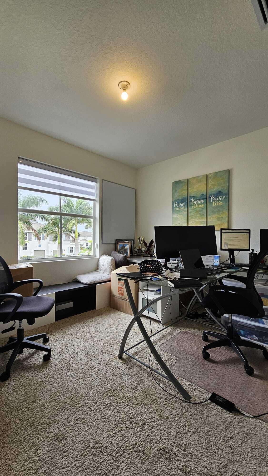 1677 Southeast 8th Street Homestead, FL 33034 - Photo 10 of 52 a living room with furniture a large window and a table