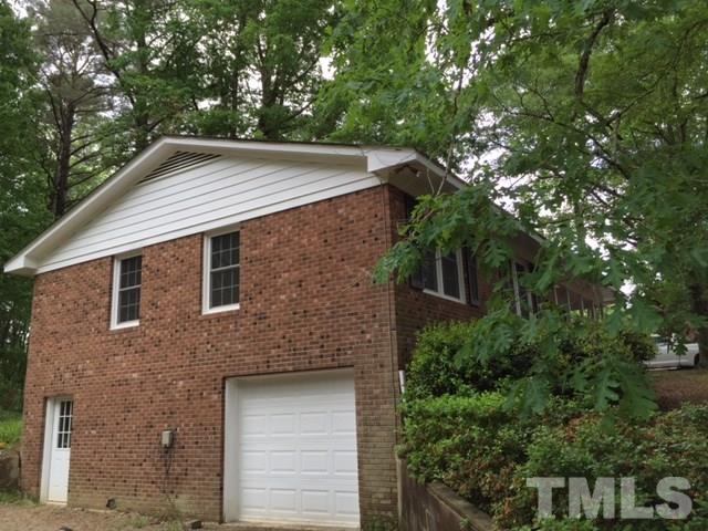 536 Gay Road Zebulon, NC 27597 - Photo 2 of 4 a backyard of a house with lots of green space