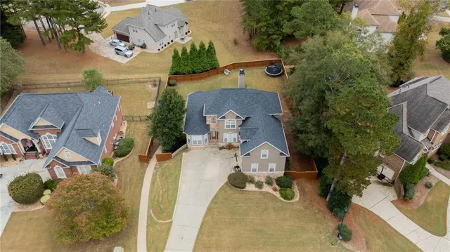 an aerial view of a house with swimming pool