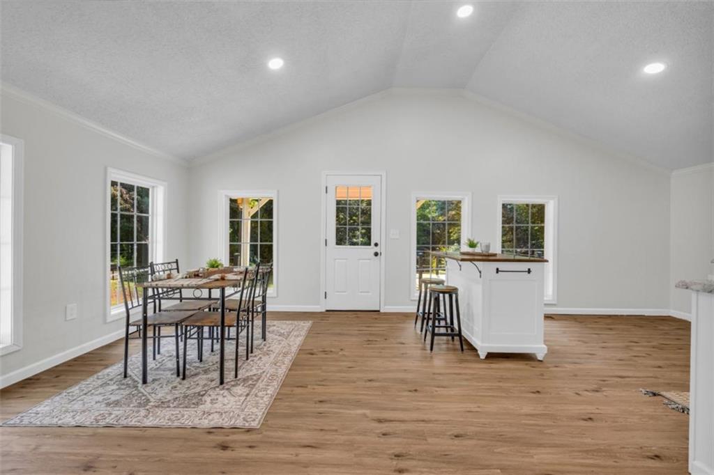 9597 Highway 334 Nicholson, GA 30565 - Photo 11 of 41 a view of a dining room with furniture and wooden floor