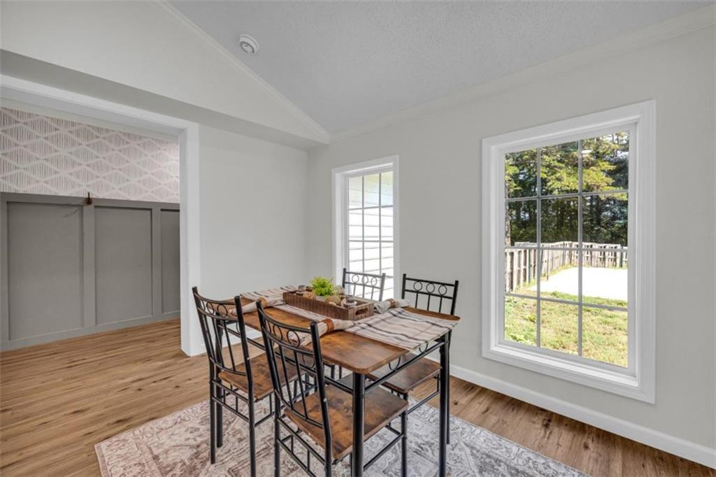 9597 Highway 334 Nicholson, GA 30565 - Photo 13 of 41 a view of a dining room with furniture and wooden floor