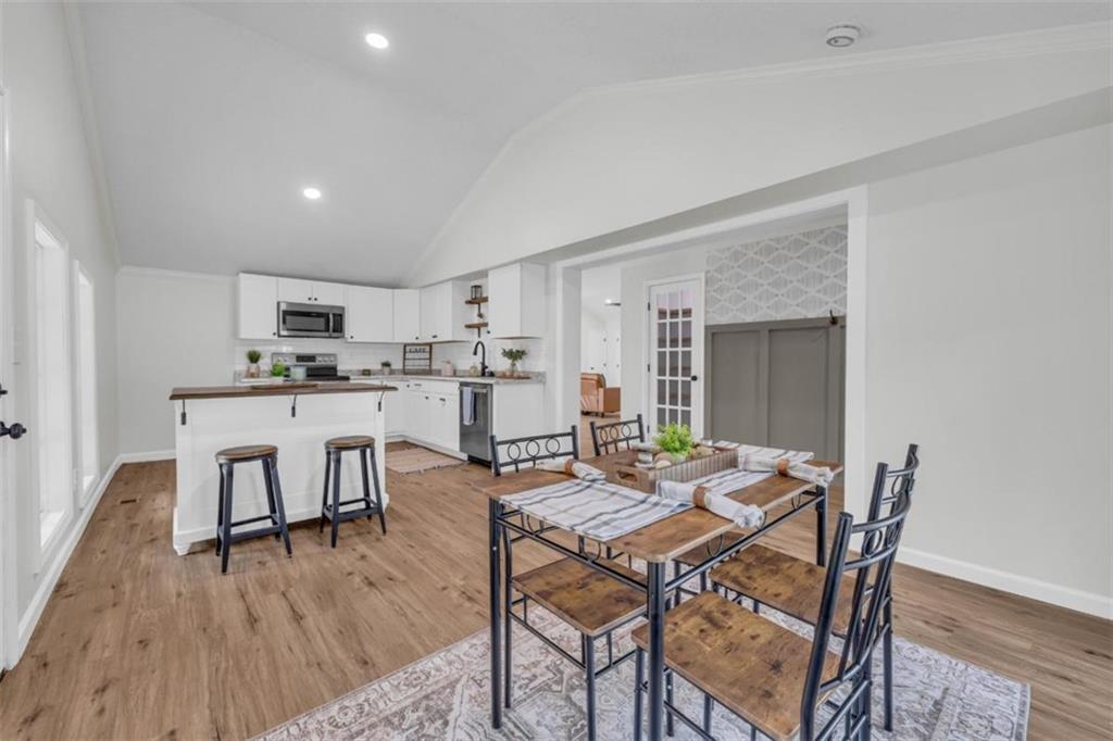 9597 Highway 334 Nicholson, GA 30565 - Photo 14 of 41 a view of a dining room with furniture and wooden floor