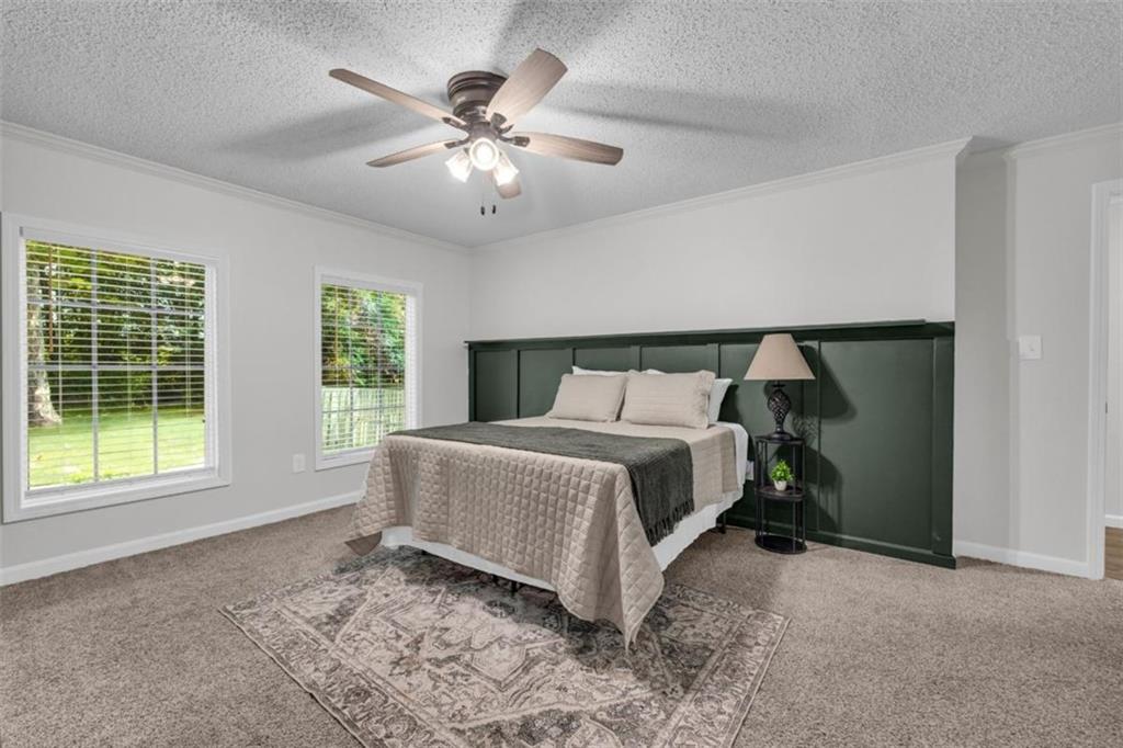 9597 Highway 334 Nicholson, GA 30565 - Photo 21 of 41 a bedroom with a bed and a large window