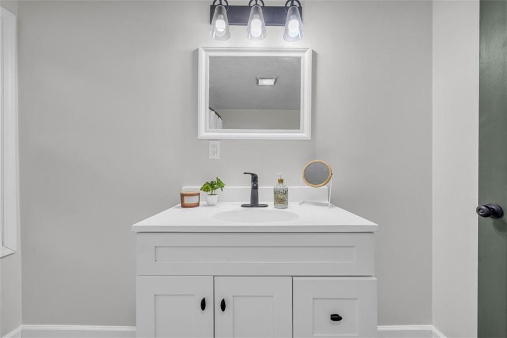 9597 Highway 334 Nicholson, GA 30565 - Photo 24 of 41 a bathroom with a sink vanity and mirror