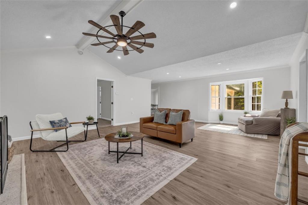 9597 Highway 334 Nicholson, GA 30565 - Photo 3 of 41 a living room with furniture and a wooden floor