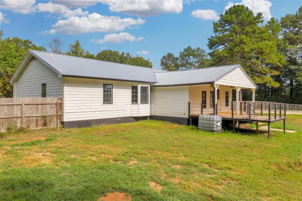 9597 Highway 334 Nicholson, GA 30565 - Photo 38 of 41 a view of a house with a swimming pool and sitting area