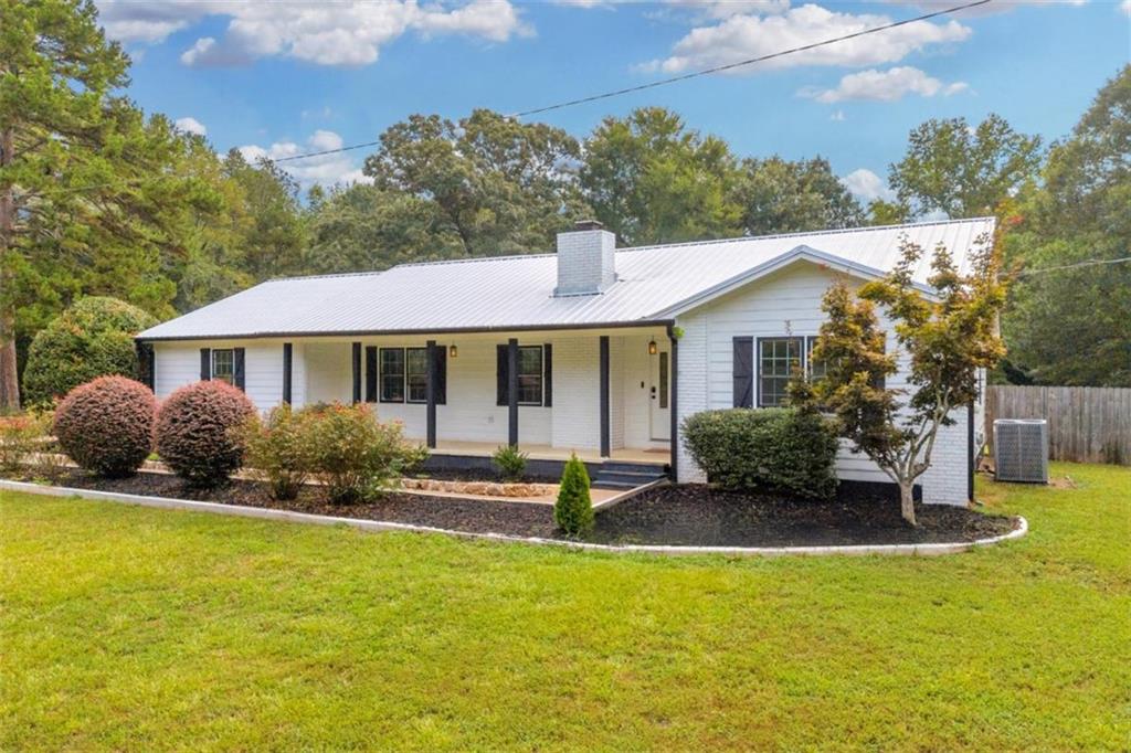 9597 Highway 334 Nicholson, GA 30565 - Photo 41 of 41 a front view of a house with garden