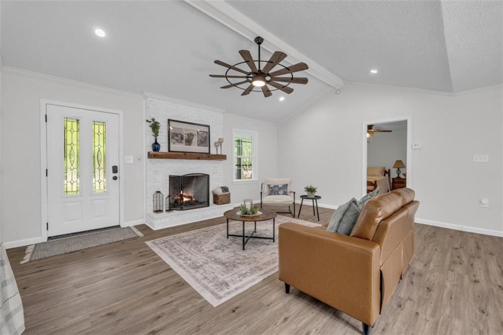 9597 Highway 334 Nicholson, GA 30565 - Photo 6 of 41 a living room with furniture and a fireplace