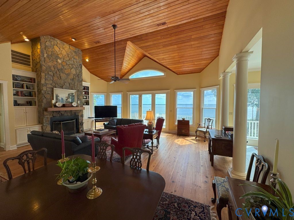 1321 Mt Prospect Road Laneview, VA 22504 - Photo 17 of 49 a dining room with furniture a fireplace and wooden floor