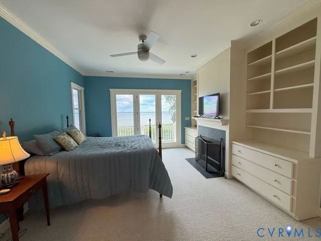 a bedroom with a bed and a television