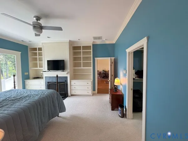 a bedroom with furniture and a window