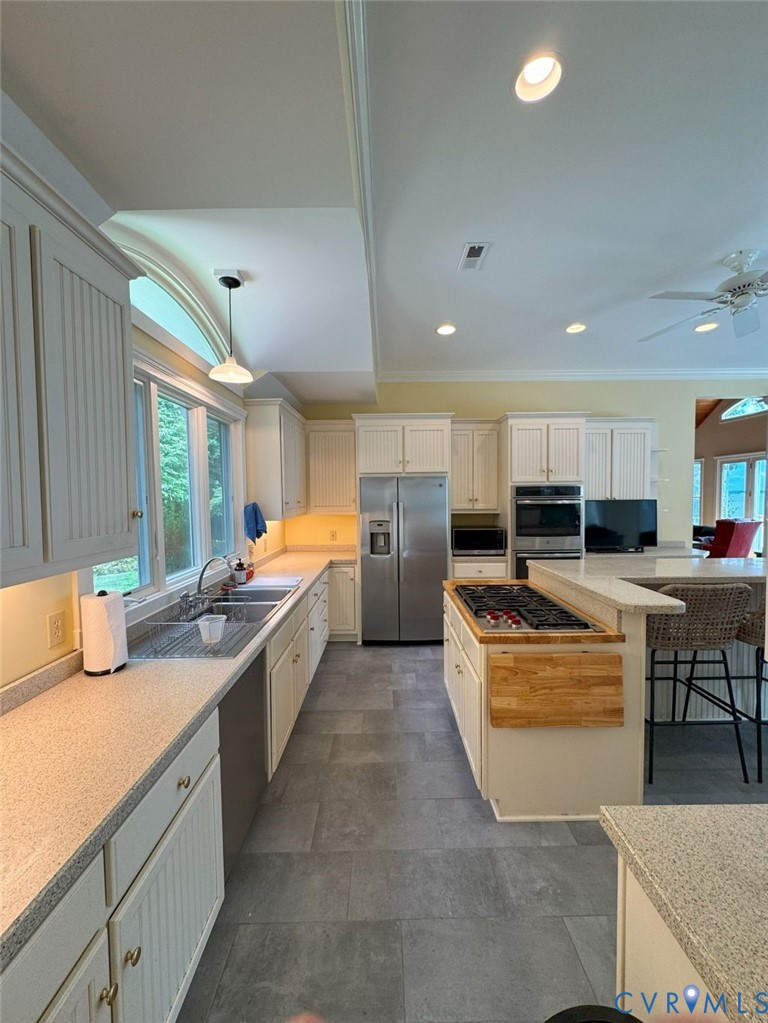 1321 Mt Prospect Road Laneview, VA 22504 - Photo 35 of 49 a large kitchen with stainless steel appliances lots of counter space and a sink