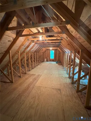 a view of an empty room with windows