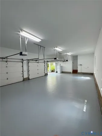 a kitchen with counter and utility room